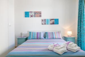 A bed or beds in a room at LE NOBILI DIMORE - appartamenti a Gallipoli