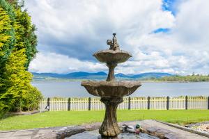 a fountain with a bird sitting on top of it at Harbour View in Kenmare