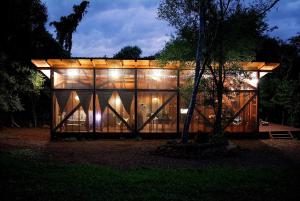 a large building with lights on it at night at Casa Naturalis Iguazú in Puerto Iguazú