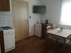 Kuchyň nebo kuchyňský kout v ubytování Guesthouse Šebalj