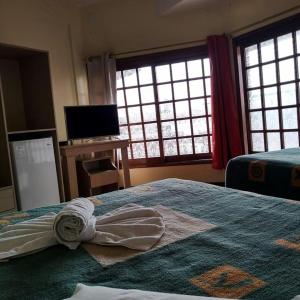 Llit o llits en una habitació de Hotel Solare