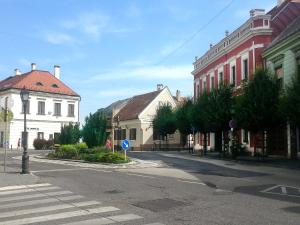 an empty street in a town with buildings at Central Apartment in Veszprém