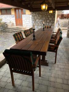 a long wooden table with chairs and sidx sidx sidx sidx at Apartments Kamp Podgrad Vransko in Vransko