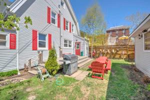 a backyard with a grill and a house at HI Charlottetown Backpacker's Inn in Charlottetown