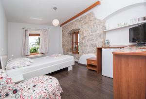 Postel nebo postele na pokoji v ubytování Oldhouse Tučepi