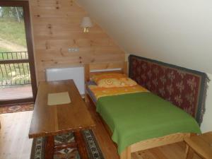 Ένα ή περισσότερα κρεβάτια σε δωμάτιο στο U Malwiny +32 φωτογραφίες