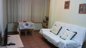 A bed or beds in a room at Hostal Sant Roc