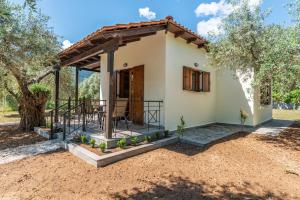 a small house with a porch at Lucia's Home in Skala Potamias
