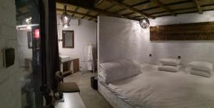 Un ou plusieurs lits dans un hébergement de l'établissement Guixu Huatang Homestay