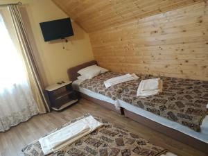 Postel nebo postele na pokoji v ubytování Camelot