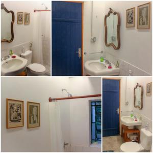 a bathroom with a sink and a toilet and a mirror at Quarto Varanda - Residência Gaia Itatiaia in Itatiaia