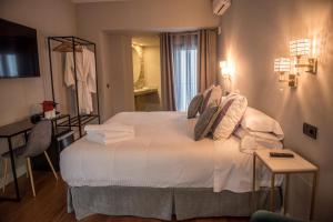 Postel nebo postele na pokoji v ubytování Hotel Don Juan Boutique
