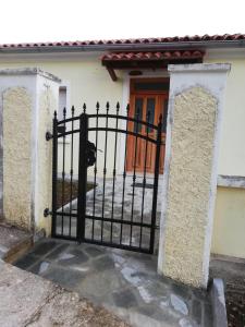 a black gate in front of a house at Villa Frane 101 in Beli