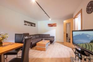 TV a/nebo společenská místnost v ubytování Appartement Unterbering