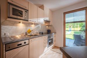 Kuchyň nebo kuchyňský kout v ubytování Appartement Unterbering