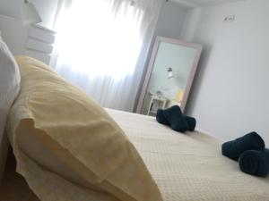 Łóżko lub łóżka w pokoju w obiekcie Casa Luz