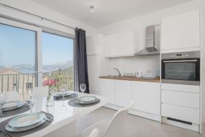 A kitchen or kitchenette at Apartments Lidija