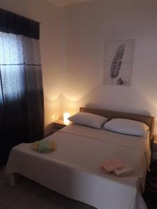 Postel nebo postele na pokoji v ubytování Apartments Hrga