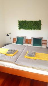 Posteľ alebo postele v izbe v ubytovaní Apartment Greenhouse