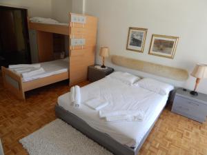 a bedroom with a bed and a bunk bed at Zira Holiday House in Makrýgialos