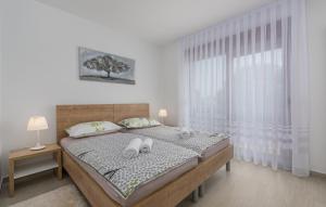 Ένα ή περισσότερα κρεβάτια σε δωμάτιο στο Apartments Hana in Funtana
