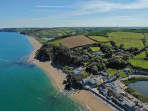 an aerial view of a beach with houses and the ocean at 10 At The Beach, Torcross in Beesands