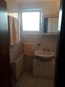 Koupelna v ubytování Apartments Hrga