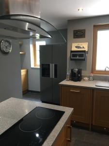 a kitchen with a refrigerator and a counter top at No 14 in Portsmouth