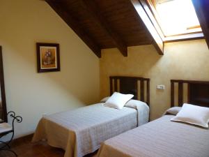 Un pat sau paturi într-o cameră la Casas Cleto - Laspuña