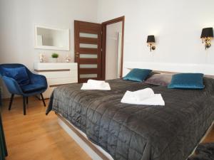 Posteľ alebo postele v izbe v ubytovaní Grand-Tourist Amber Rose Apartment