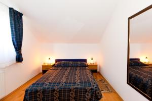 Posteľ alebo postele v izbe v ubytovaní Plitvice Pension Perisic