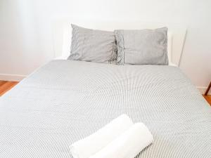 Posteľ alebo postele v izbe v ubytovaní Pension Aussie Guesthouse