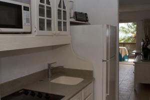 Dapur atau dapur kecil di Tropical Sunset Beach Apartment Hotel