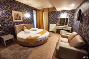 Ένα ή περισσότερα κρεβάτια σε δωμάτιο στο Ξενοδοχείο Atlantic