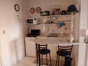 Virtuvė arba virtuvėlė apgyvendinimo įstaigoje Conheça Caxambu e sua Natureza
