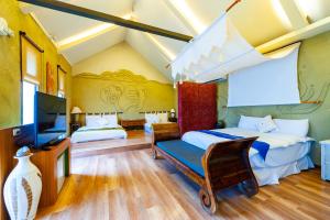 Letto o letti in una camera di Pancala Vacation Inn