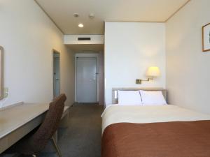 Postel nebo postele na pokoji v ubytování Chino Sky View Hotel + 37 fotografií
