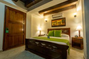Voodi või voodid majutusasutuse Hotel Don Pedro De Heredia toas