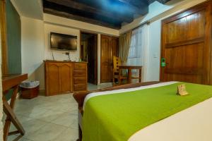 Voodi või voodid majutusasutuse Hotel Don Pedro De Heredia toas