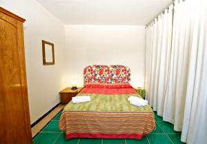 Posteľ alebo postele v izbe v ubytovaní Villa Casale Ravello Residence
