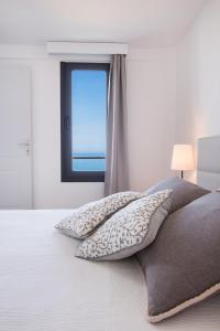 Postel nebo postele na pokoji v ubytování Kimata Apartments