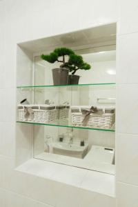 a bathroom with a sink and a mirror at LCT Charming Beach House in Hvar