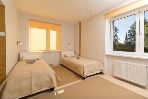Postel nebo postele na pokoji v ubytování Observatory apartement