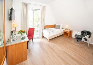 Postel nebo postele na pokoji v ubytování Gästehaus fliegendes Perlhuhn Borgfeld