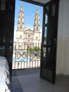 an open door with a view of a building at Hotel Plaza Las Torres in San Juan de los Lagos