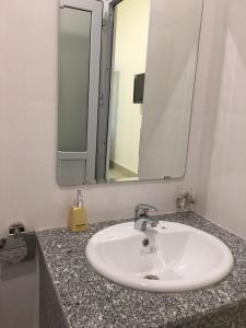 a bathroom sink with a large mirror above it at Homestay BONO Mũi Né in Phan Thiet +37 photos