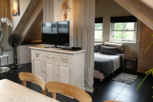Postel nebo postele na pokoji v ubytování Appartementen Het Oude Atelier