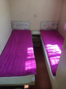 Ліжко або ліжка в номері Kupai Apartman