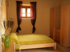 Postel nebo postele na pokoji v ubytování Agriturismo Il Poderaccio