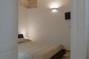 Säng eller sängar i ett rum på Isabella Apartment by Wonderful Italy